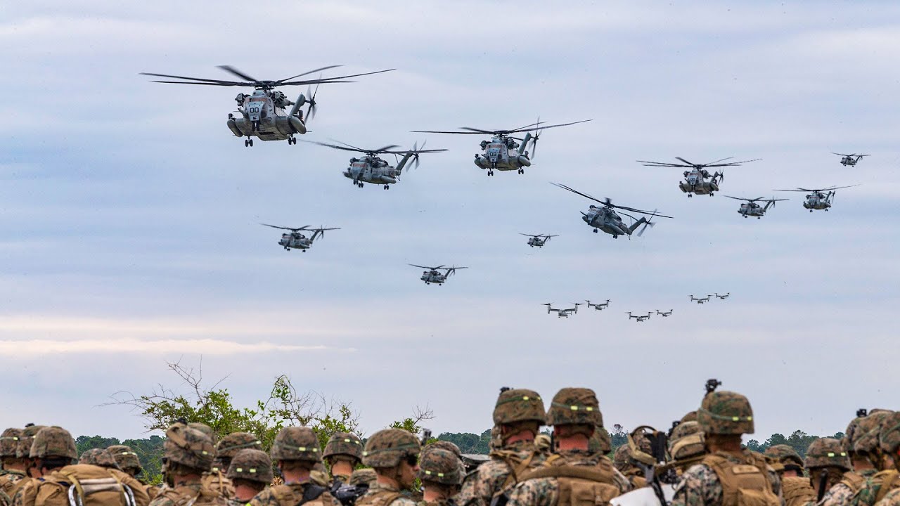 U.S. Marine Corps CH-53E Super Stallions and MV-22B Ospreys participate in a large scale air assault