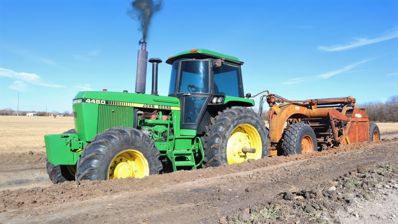 Using real tractors to dig and move dirt on the farm