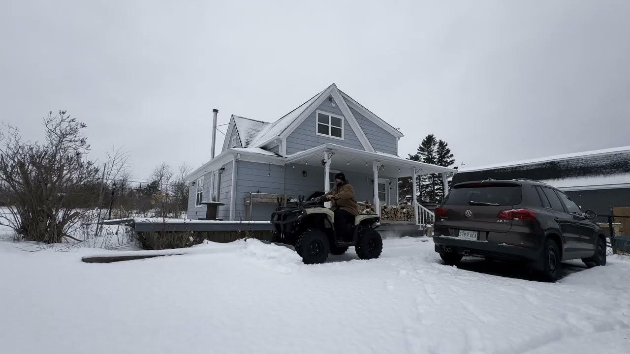 SNOW DAYS AT HOME ON THE ATV AND CUTTING WOOD