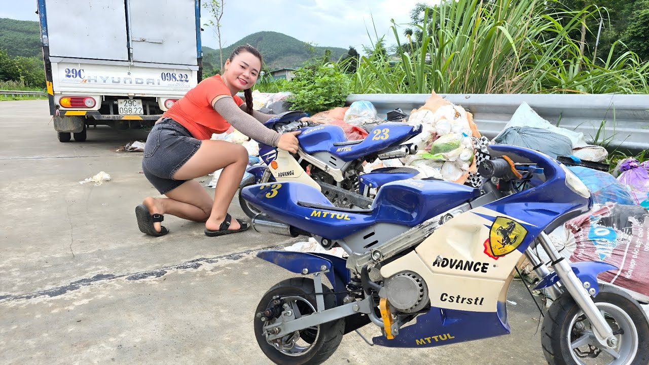 The girl repaired and restored the mini motorbike for a long time.