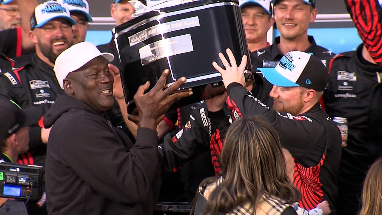 MICHAEL JORDAN CELEBRATES IN VICTORY LANE WITH HIS DRIVER TYLER REDDICK AFTER DAYTONA 500 WIN.
