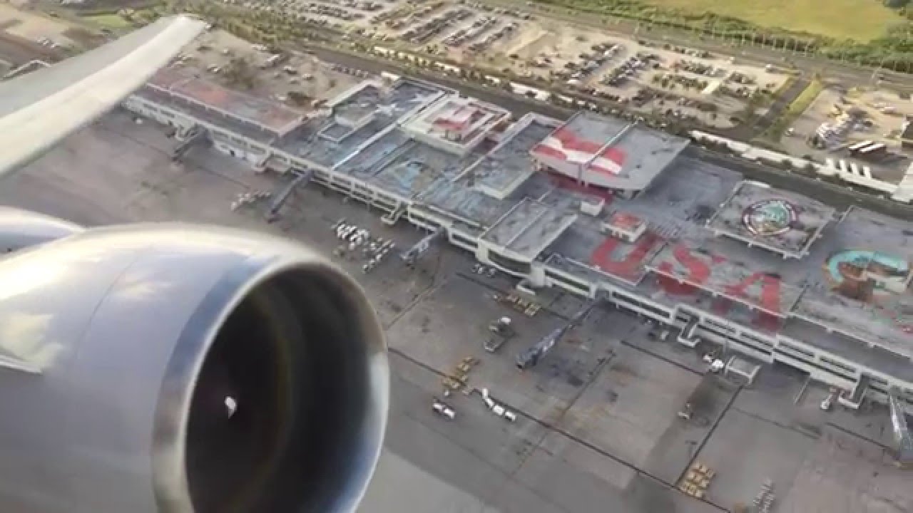 United 777-200 takeoff from Guam - Wing View - PW engines