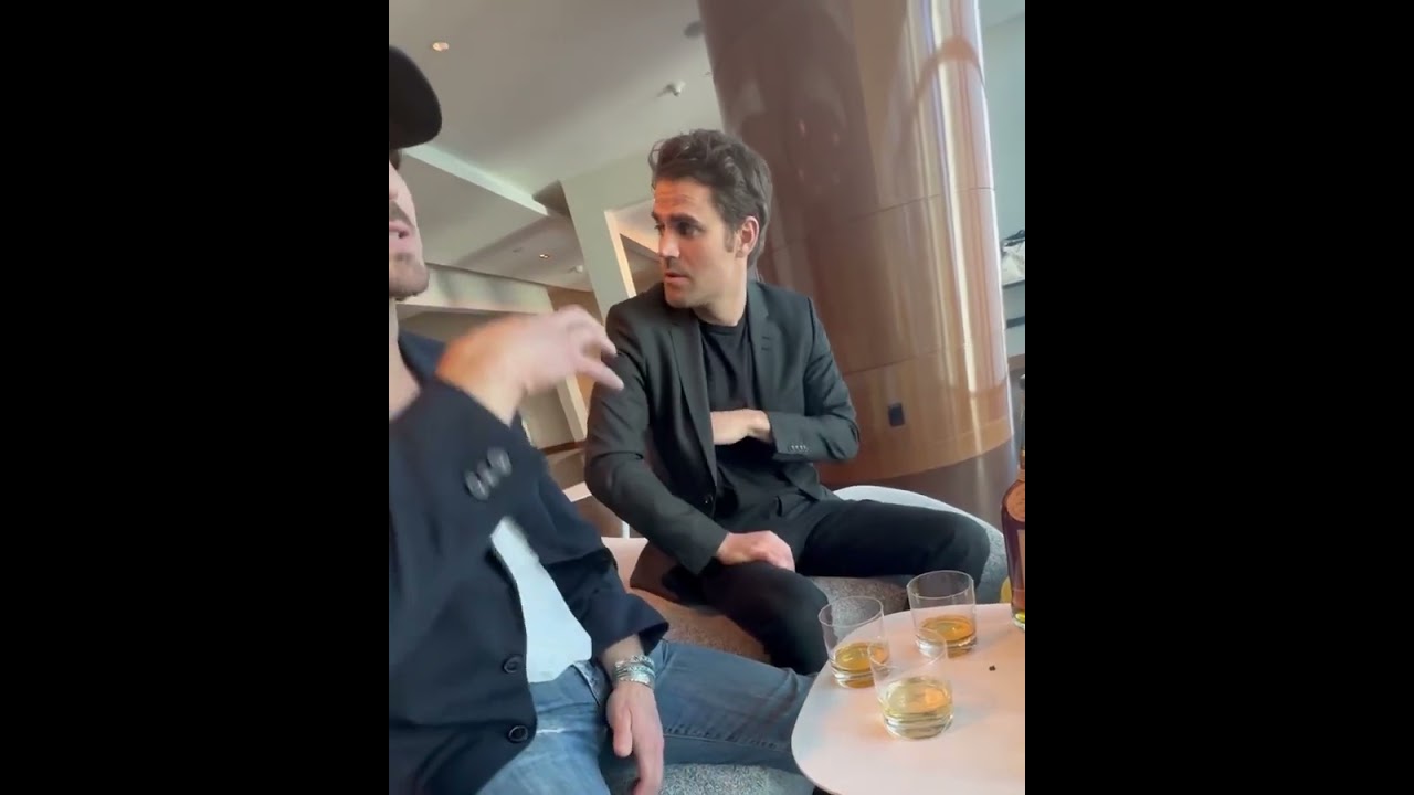 Paul Wesley listening to Ian Somerhalder