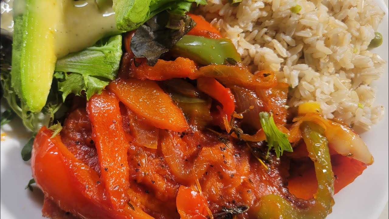 Salmon with peppers and onions with brown rice and baby green salad with avocado and dressing 