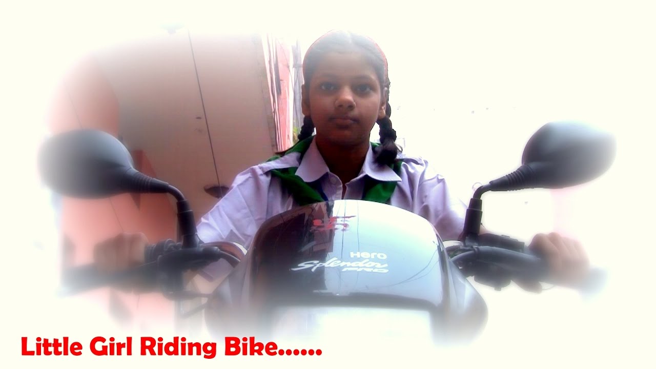 GIRL RIDING BIKE