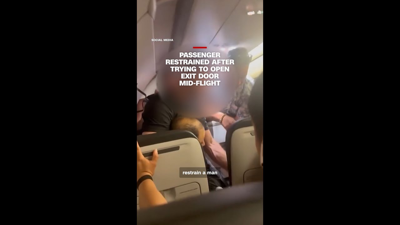Passenger restrained after trying to open exit door mid-flight