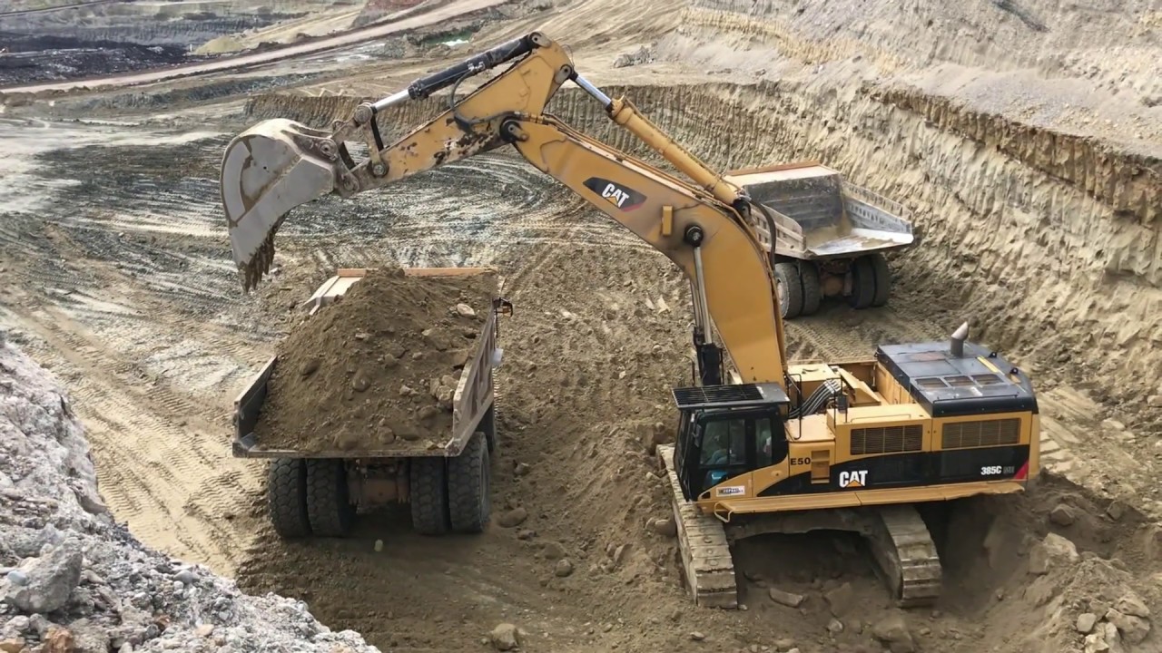Caterpillar 385C Excavator Loading Caterpillar Dumpers - Interkat SA