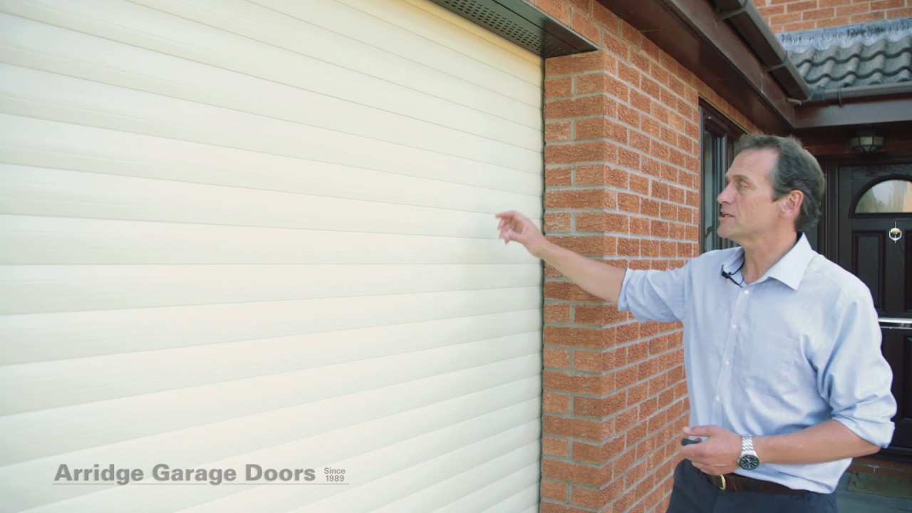 Insulated automatic roller garage door.