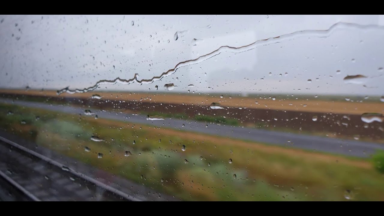 Beautiful view from the train window II Rain on train window II Stock Footage
