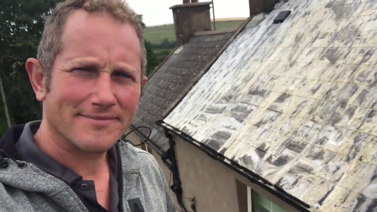 Softwash cleaning of man-made artificial roof slates