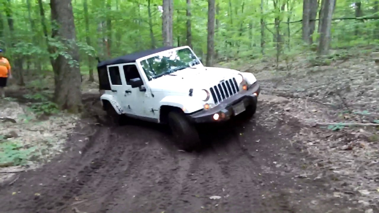 Stock Jeep Offroading Muddy Trail