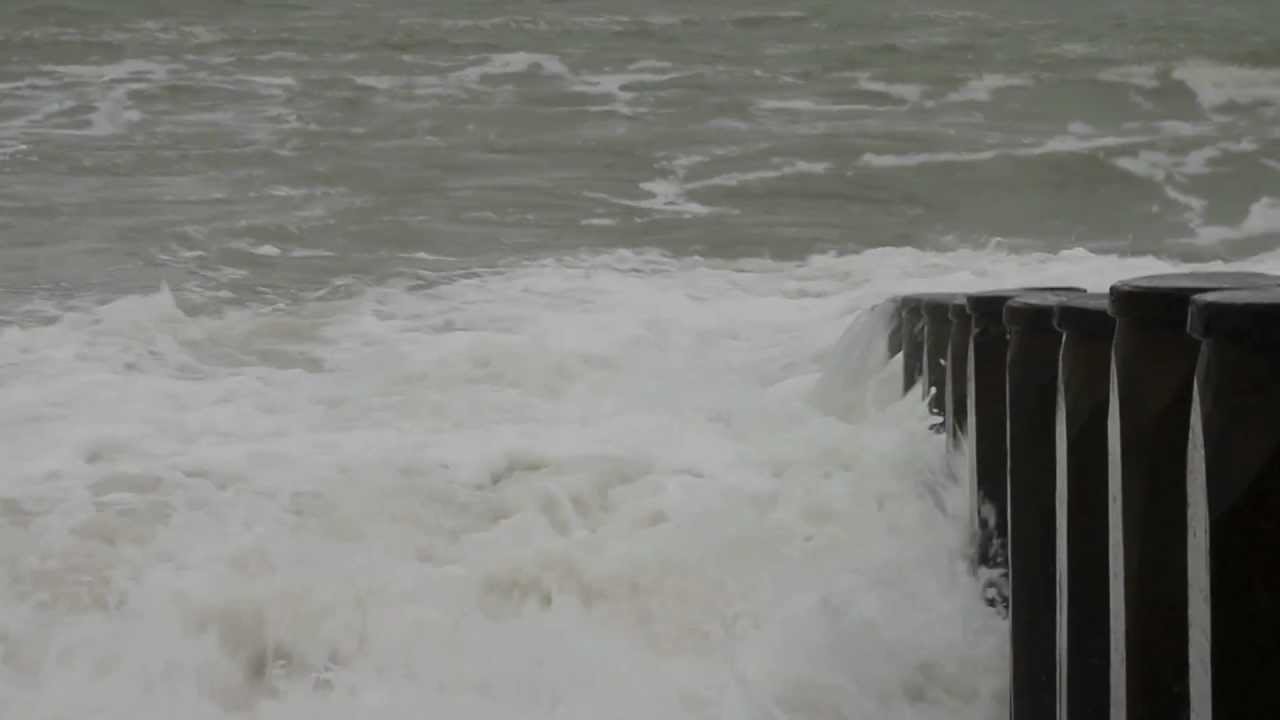 A windy day on Eastbourne beach with rough seas