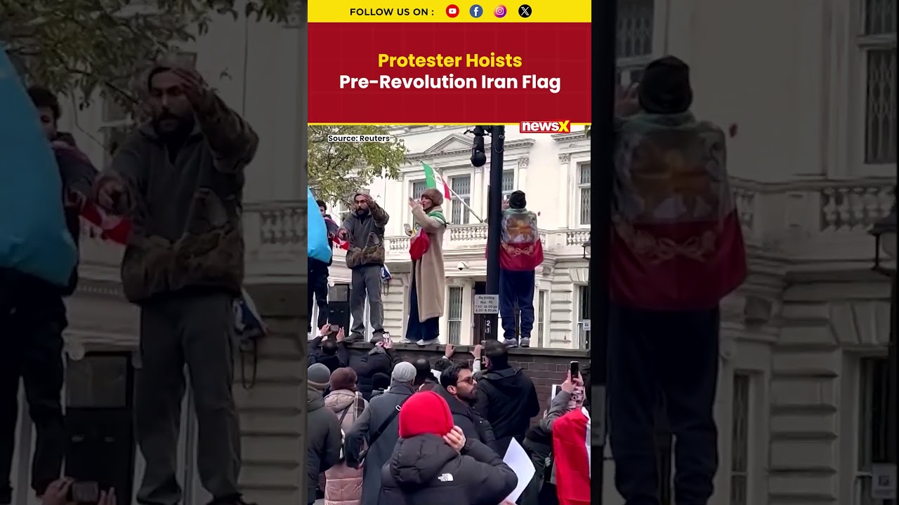 Protester Hoists Pre-Revolution Iranian Flag At Iran&rsquo;s London Embassy Amid Anti-Regime Rally