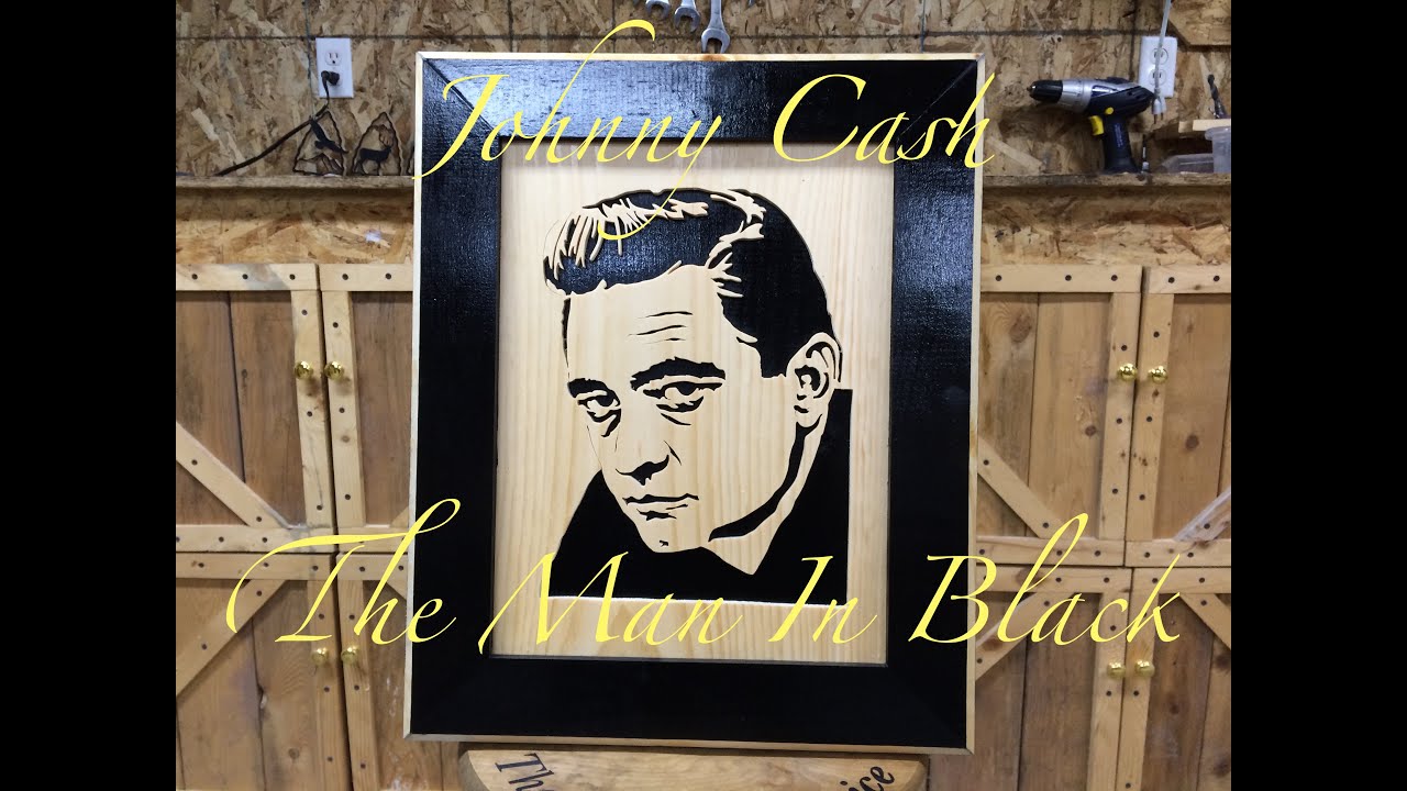 Cutting a Johnny Cash portrait on a scroll saw