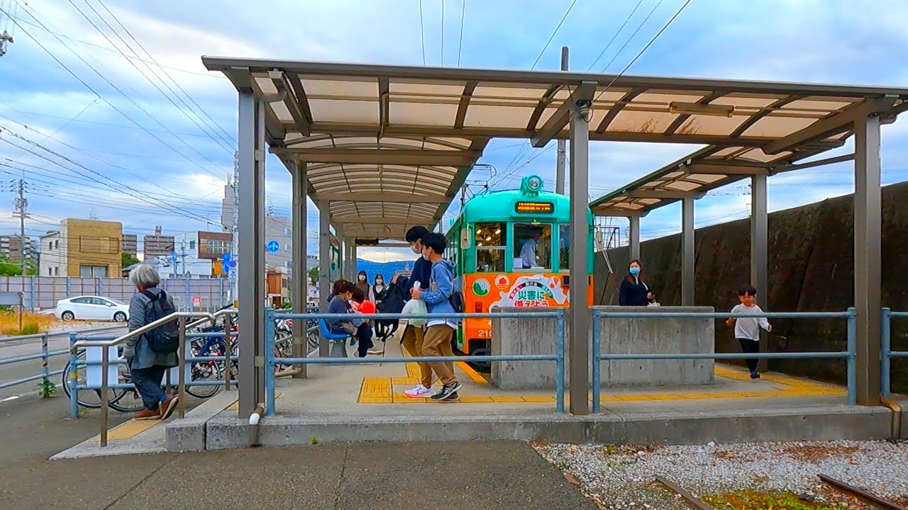 Shikoku Cycling - Street in a provincial city with tram runnning | Kochi City, Japan