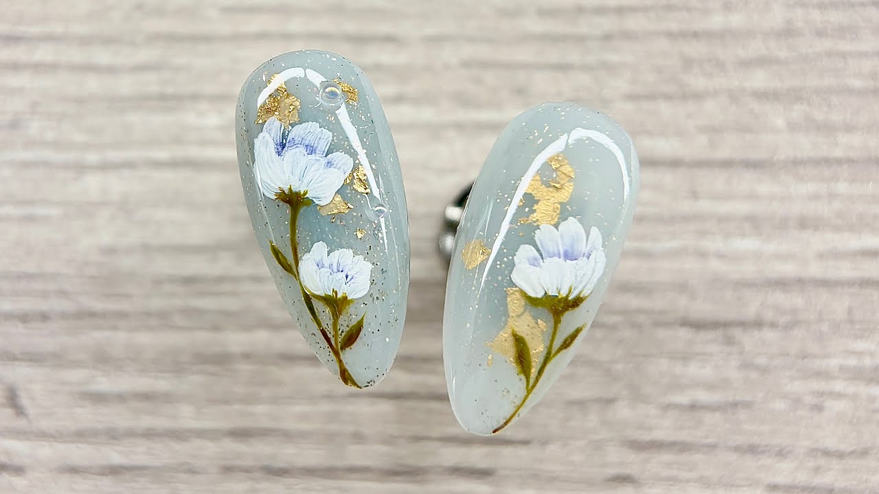 Elegant Hand-Painted Floral Nail Design | Subtle Light Blue & Gold Accent