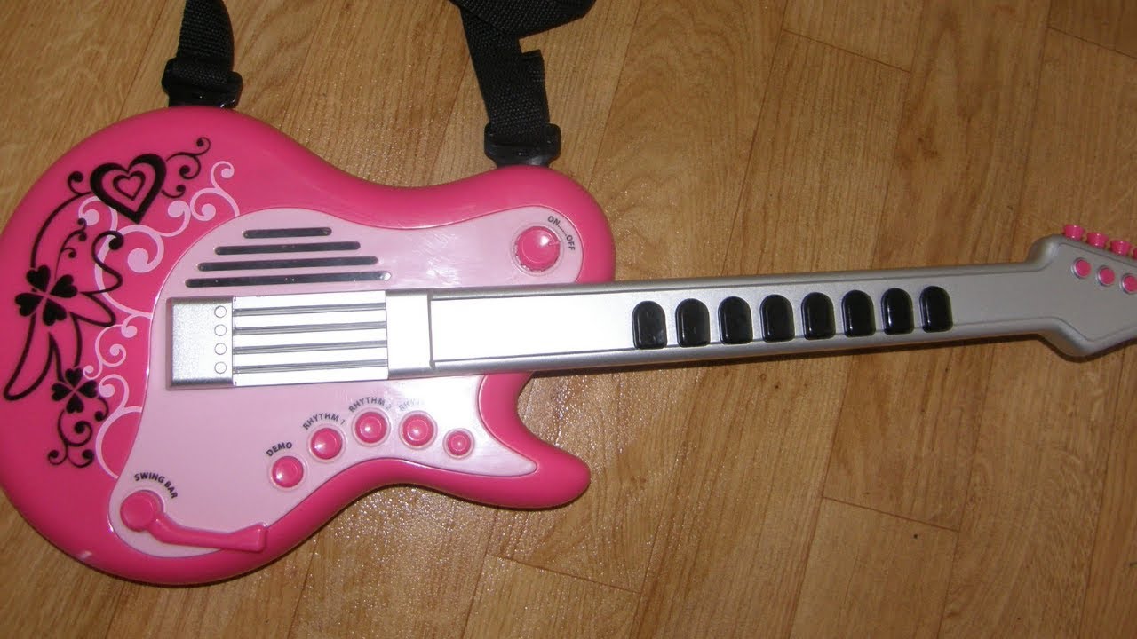 Guitar toy with music.Early Learning Centre Superstar Guitar, Pink