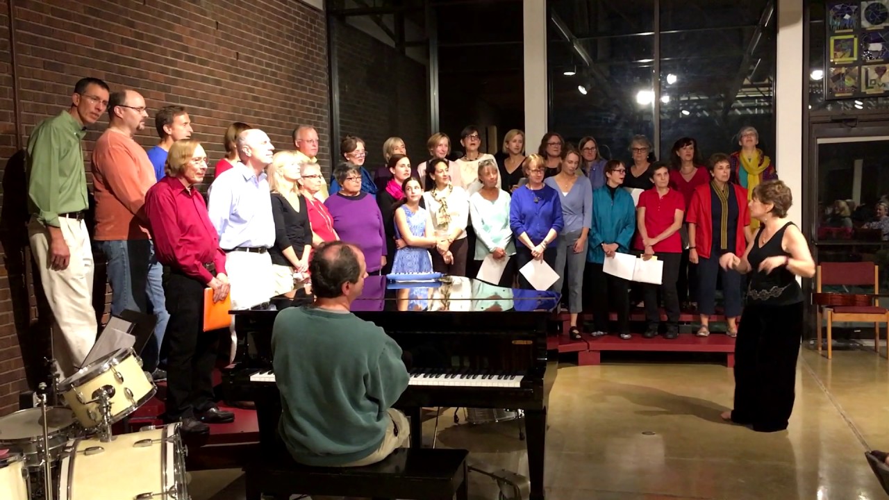 The One World Community Choir sings 