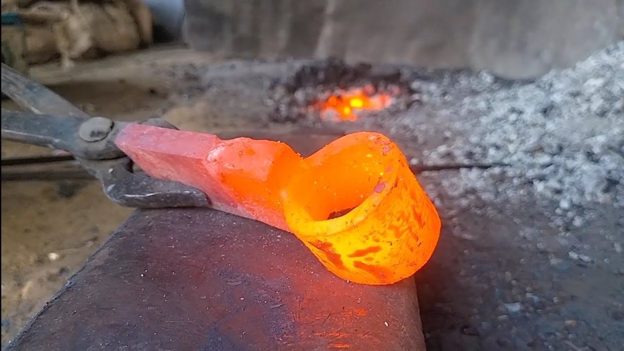 Axe made by joining 2 iron pieces , leaf spring 