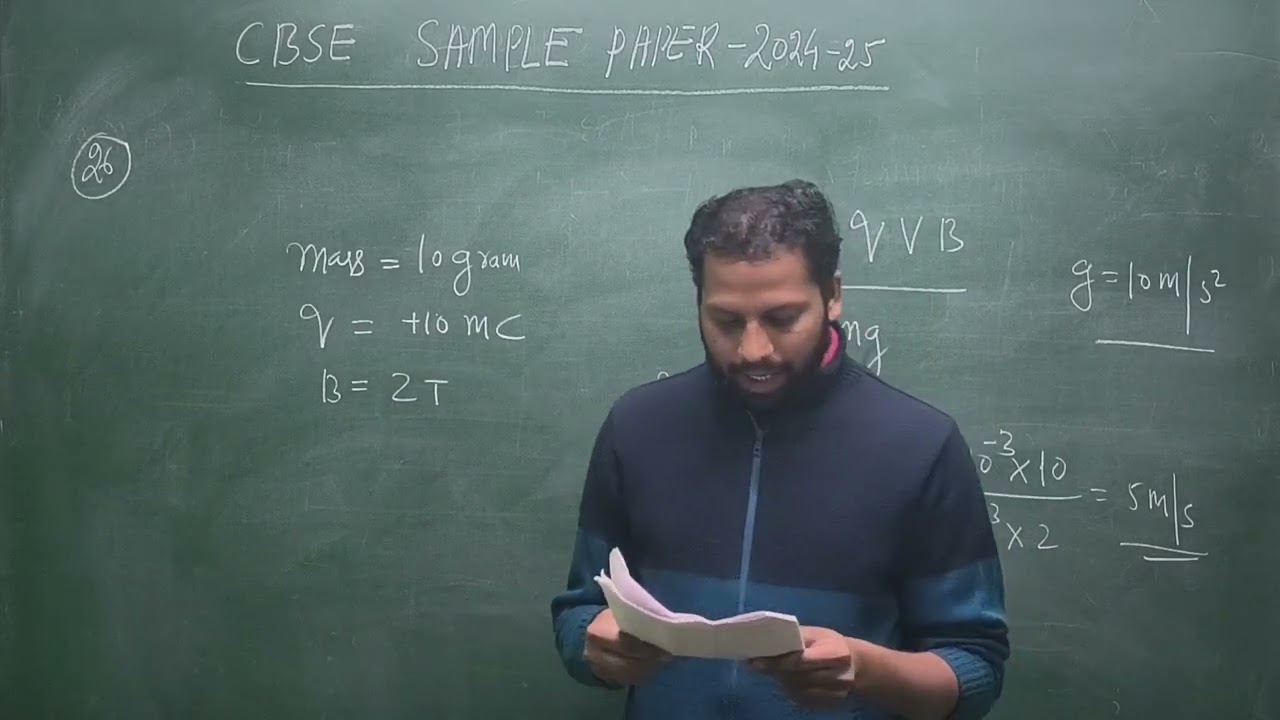 Q26. A boy is holding a smooth, hollow and non-conducting pipe vertically with charged spherical