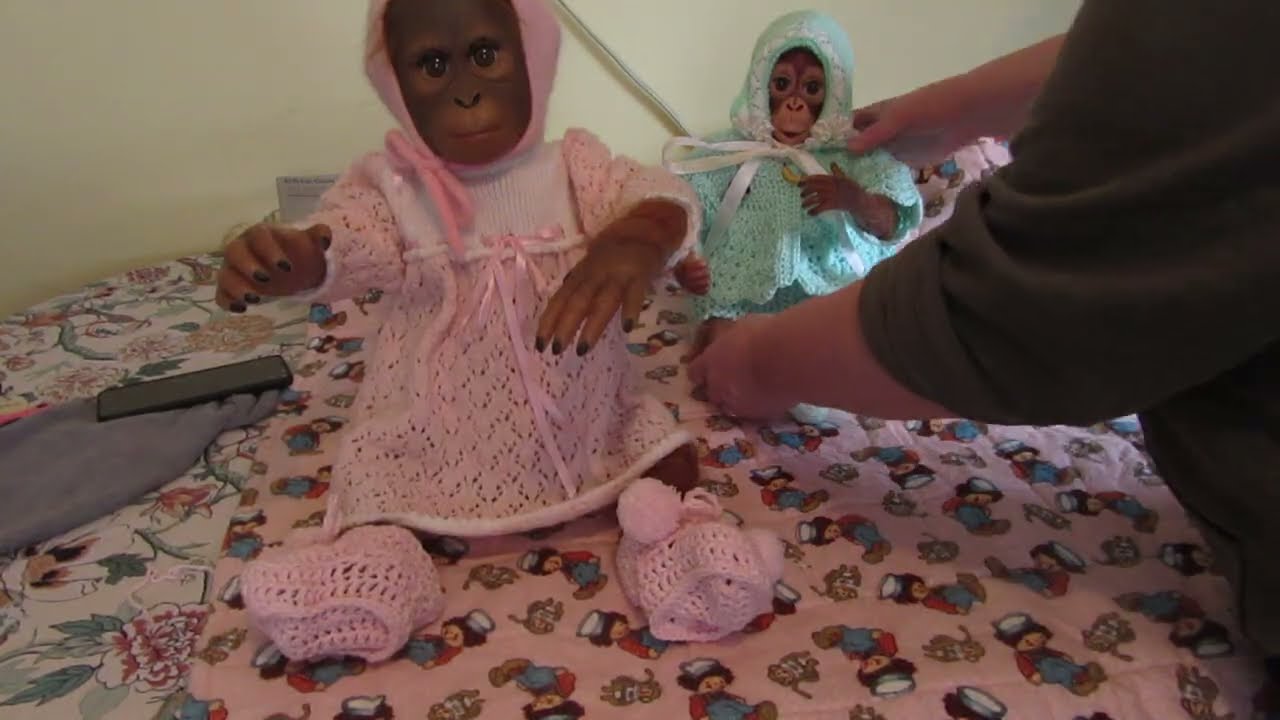 Putting on the woolies  - the broken doll