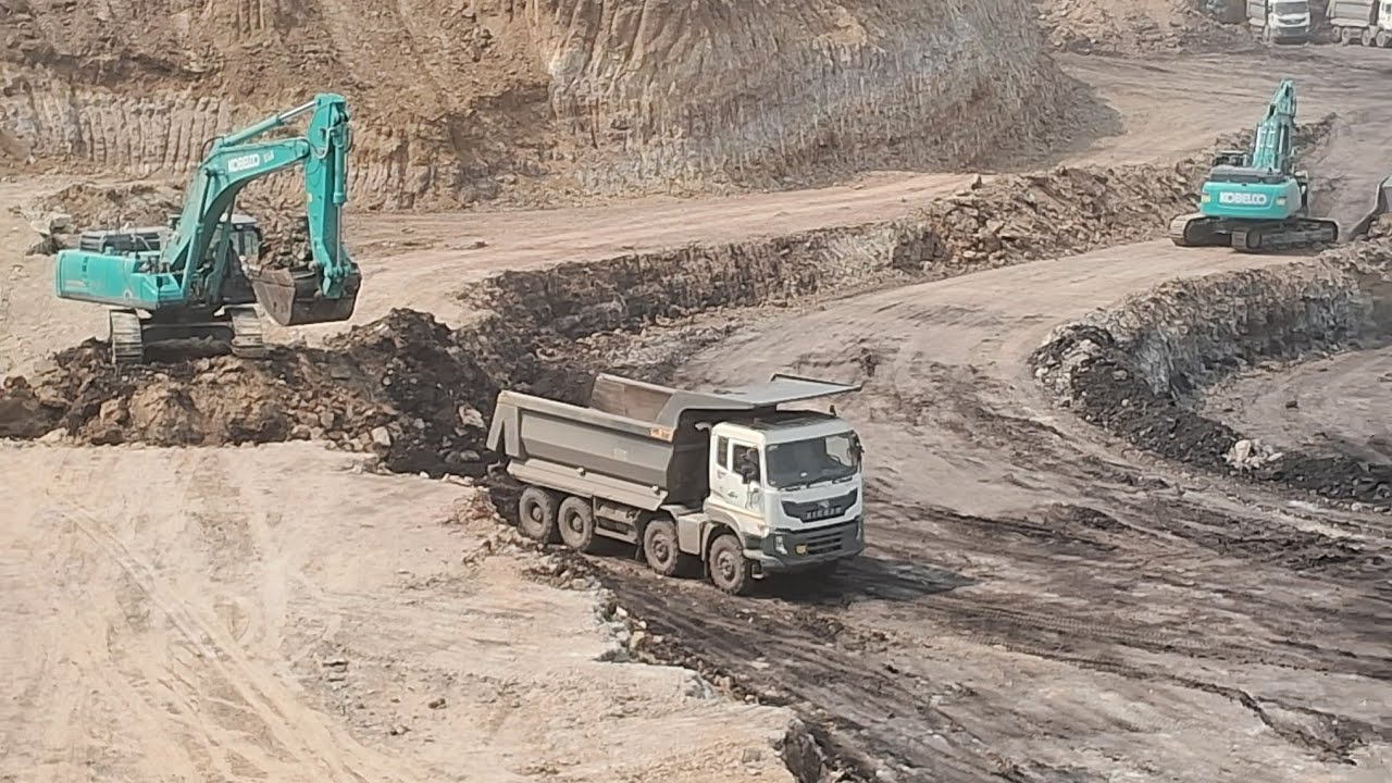excavator loding OB = over burden a maining truck