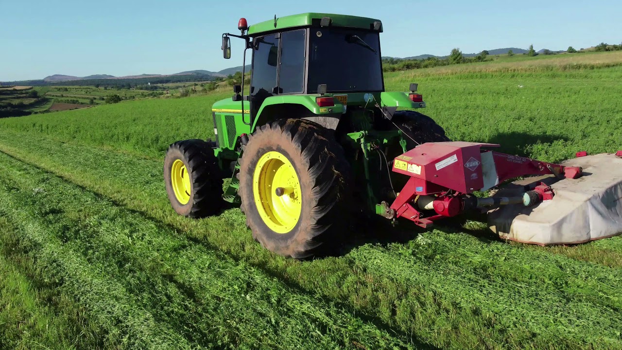 JOHN DEERE 7700 +KUHN GMD 702