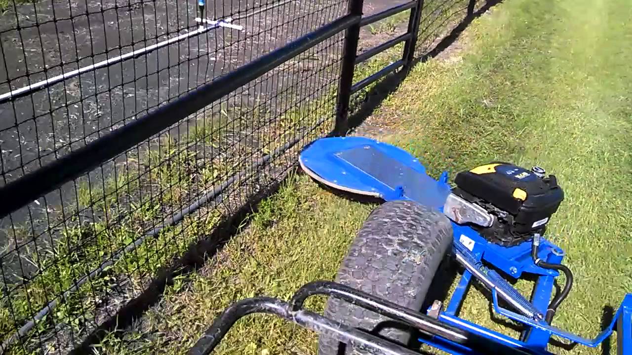 Fence line trimmer/tow behind