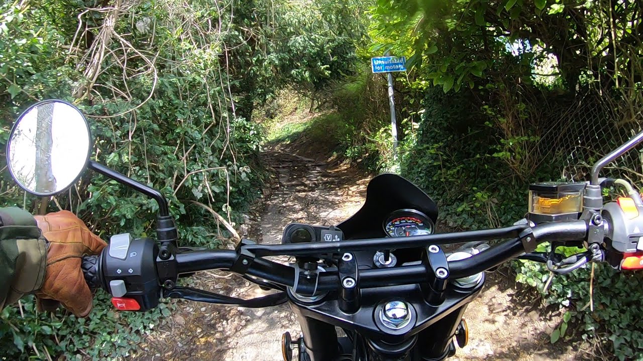 Herald 250 Maverick climbing big steps off road.