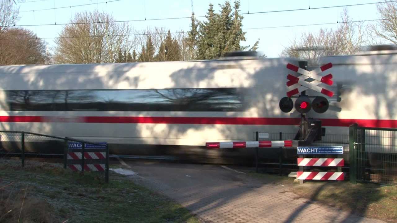 German high speed train (ICE3) and Dutch railroad crossing