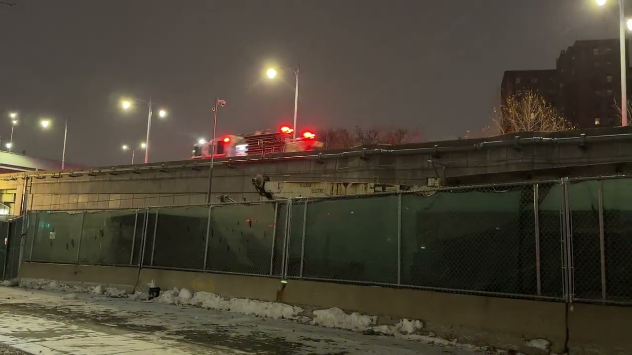 FDNY ENGINE 35 & FDNY TOWER LADDER 14 RESPONDING ON THE RFK BRIDGE IN HARLEM, MANHATTAN, NEW YORK.