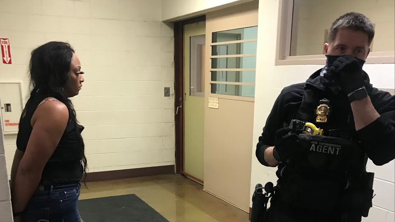 Fugitive attempts to hide under a pile of wigs to avoid capture $100,000 Bond