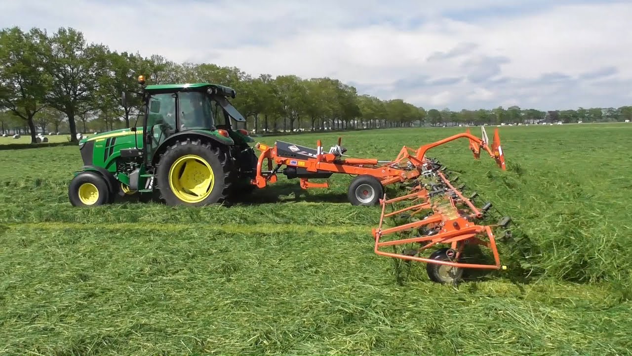 Tedding silage with JD & Kuhn