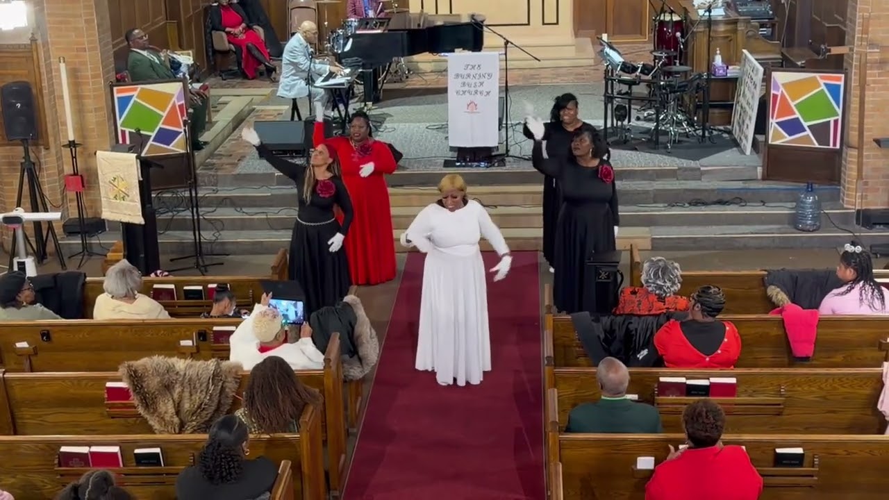 Burning Bush Church . Burning With praise , praise dance team . He has his hands on You