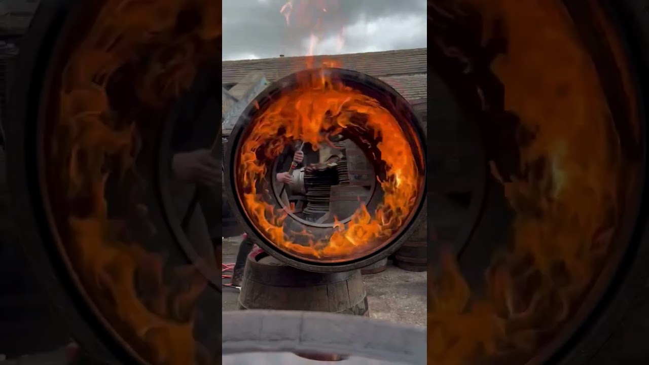 Our Cooper Euan recharring the inside of our reconditioned whisky casks
