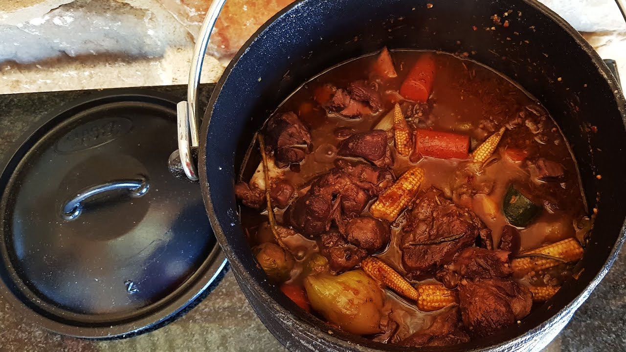 Delicious Lamb Shank Potjie on an open fire - South African Style