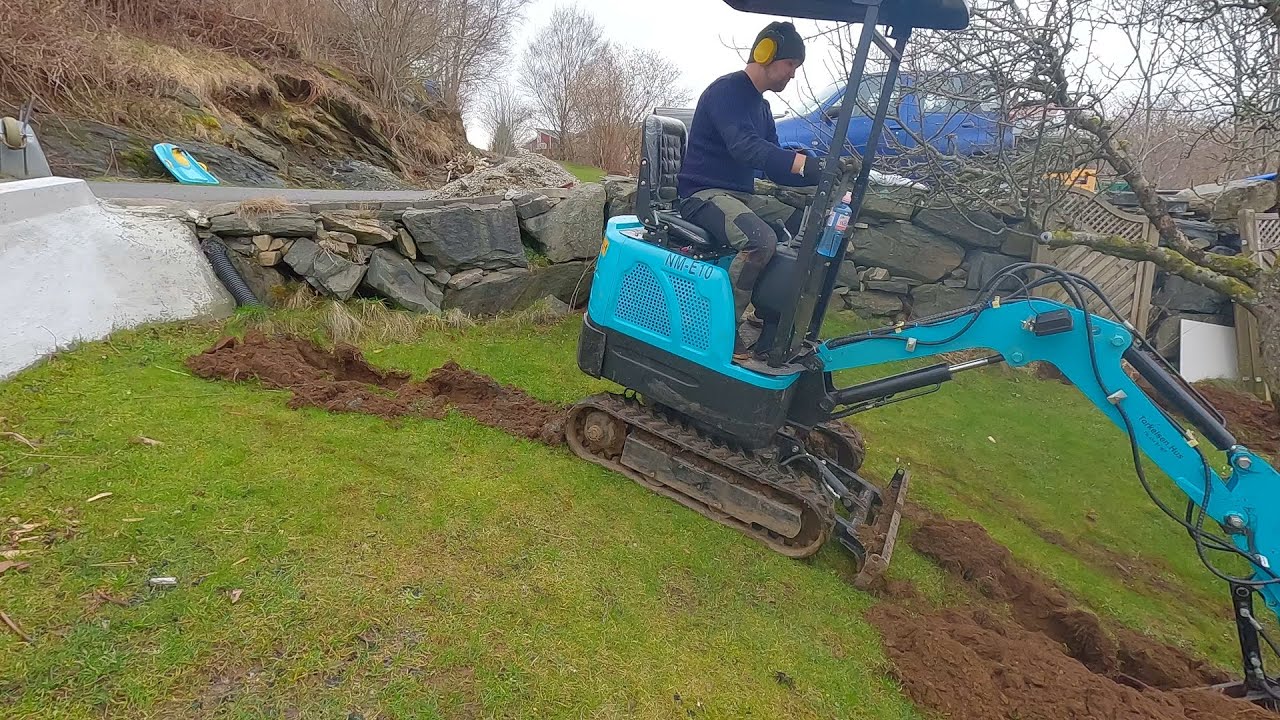 Digging as steep as possible with the 1-ton mini - doing a french drain rehab