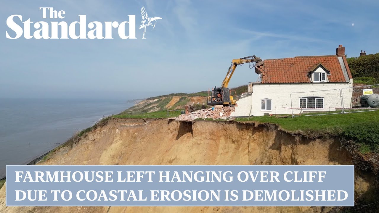 Farmhouse left hanging over cliff due to coastal erosion is demolished