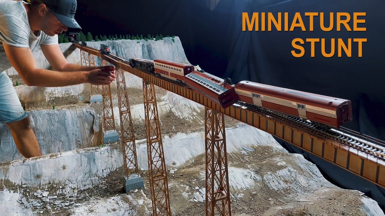 Head on train crash movie, on a bridge, derailment after collision, behind the scenes. HO scale fail