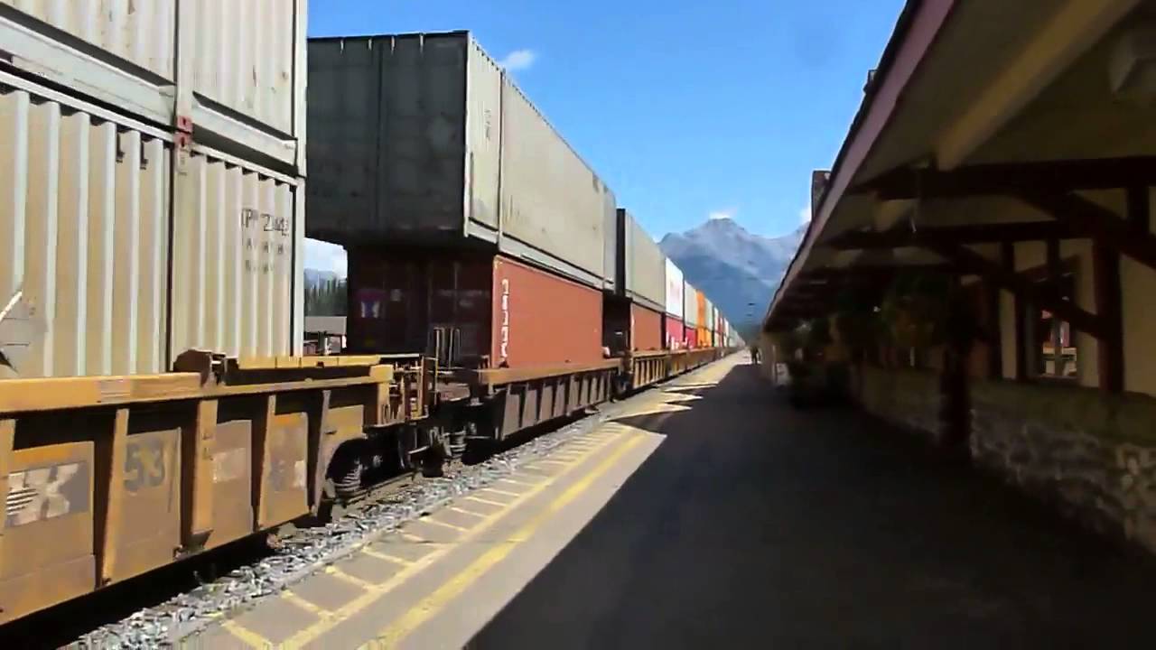 Two mile long double decker freight train runs through Banff
