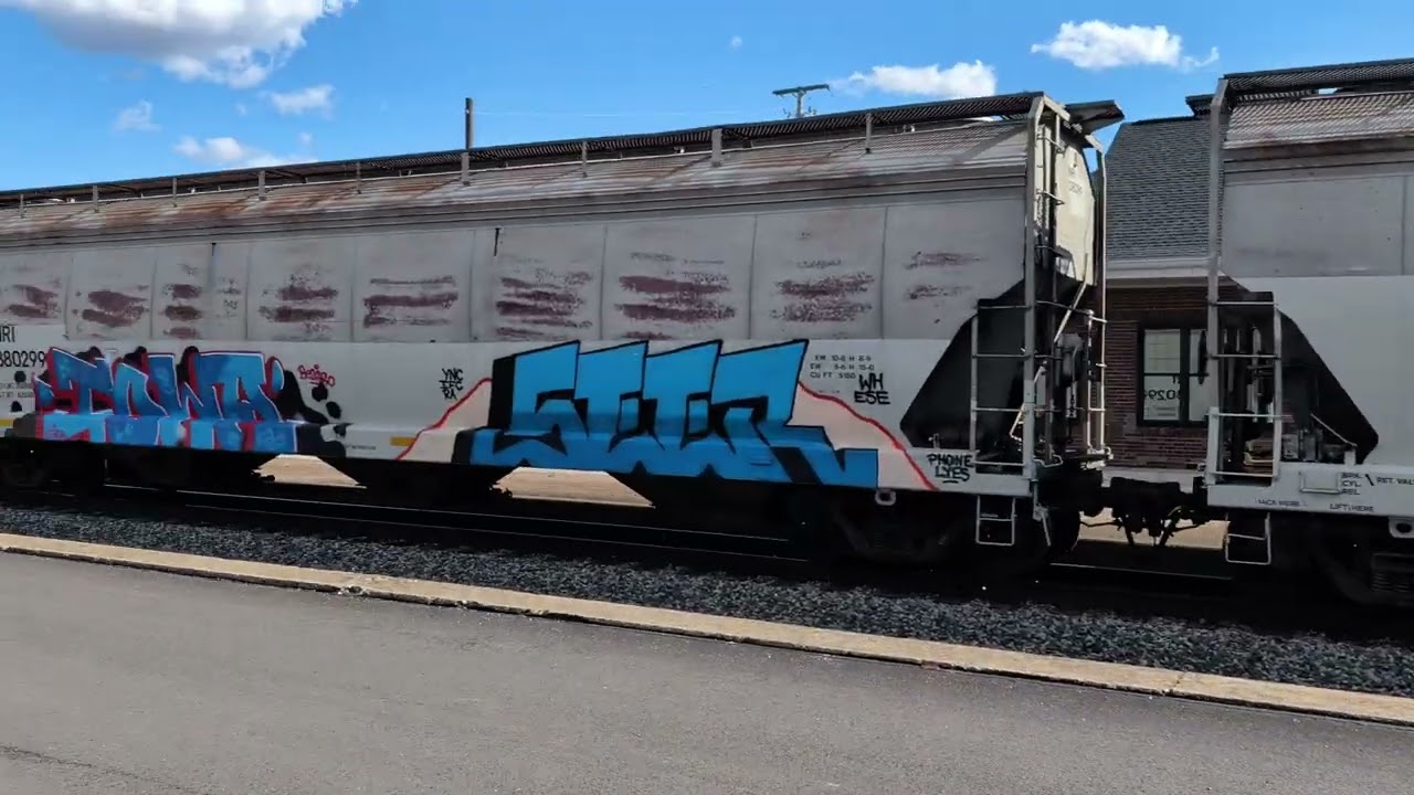A SD60M, a SD40-2 and a pair of GP38-2 locomotives hauling an OC manifest train.