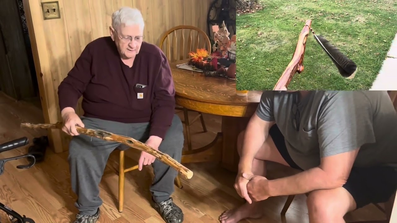 Old man shows off his walking stick collection