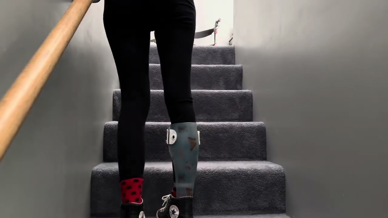 MS warrior walks upstairs at home per request