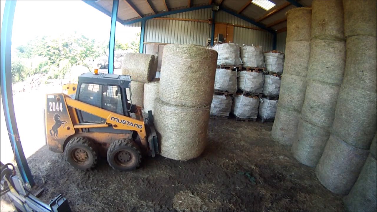Mustang 2044 and Big bale hay
