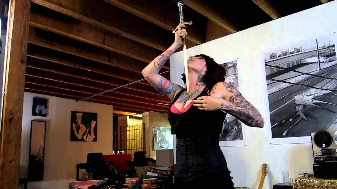 Brianna Belladonna swallowing a sword