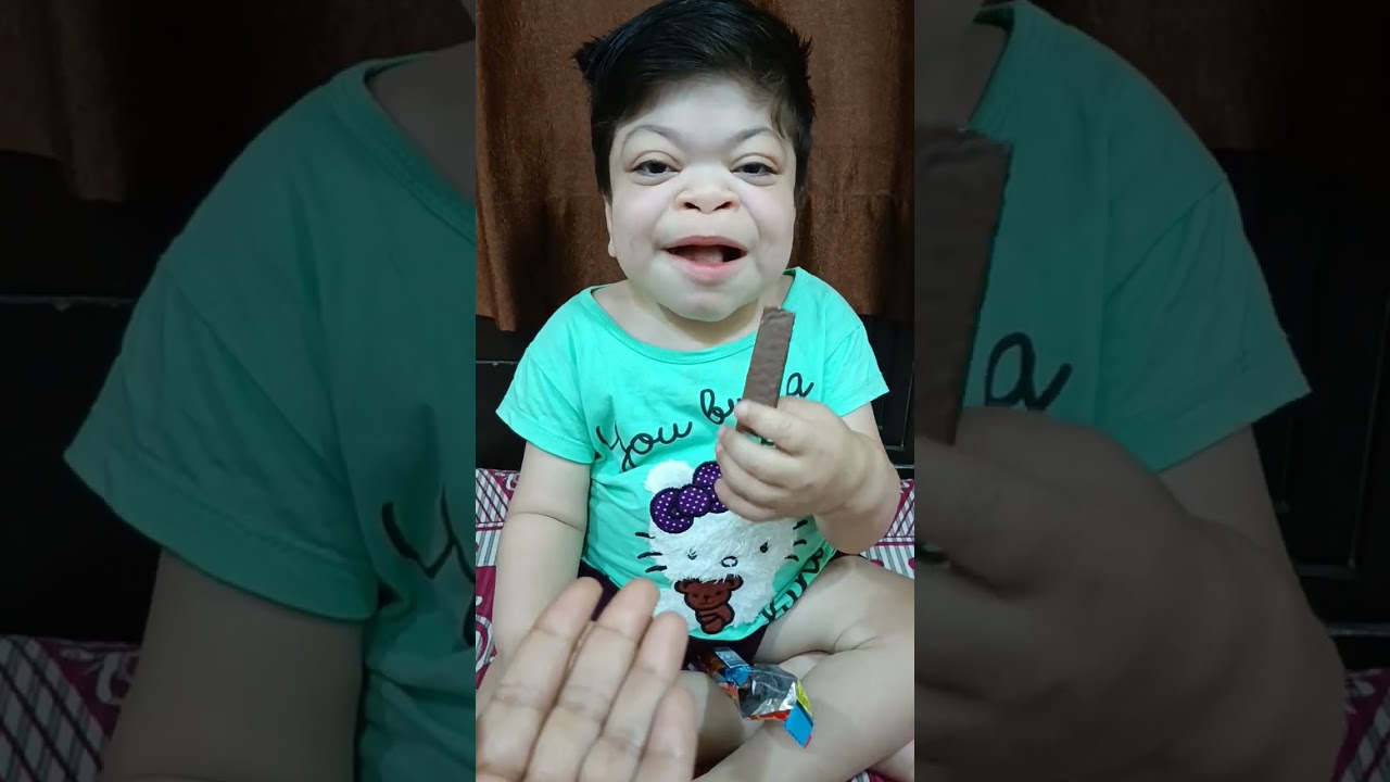 Cute girl eating Snakker chocolate 🍫