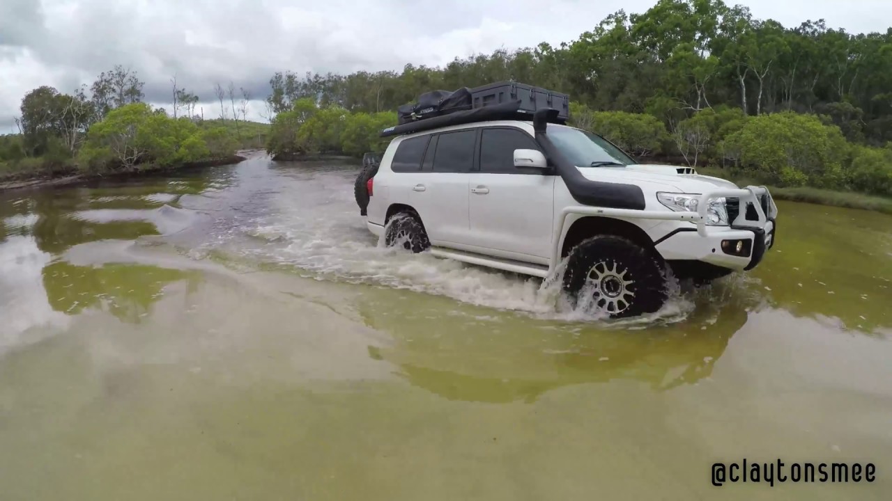 200 Series Toyota Landcruiser crossing Awinya Creek on Fraser Island, Australia.