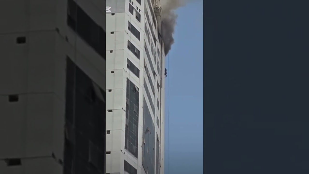 building fire & man falls to the ground @sharjah UAE