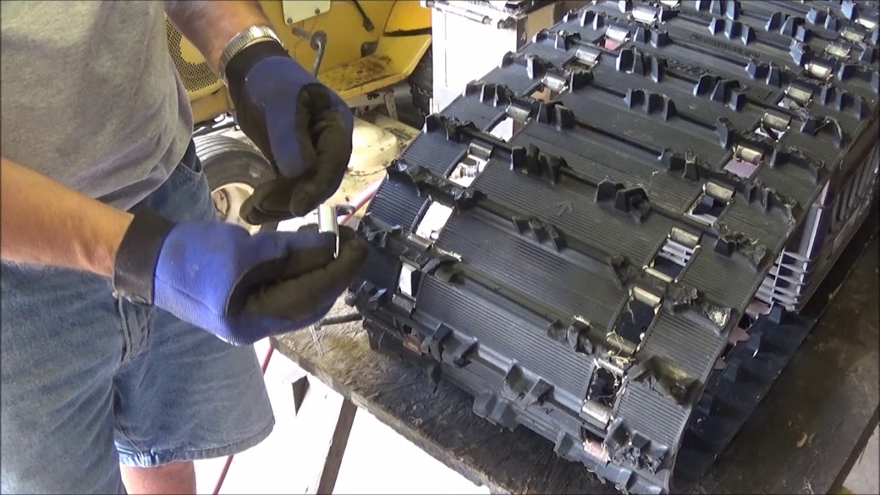Snowmobile track clip installation