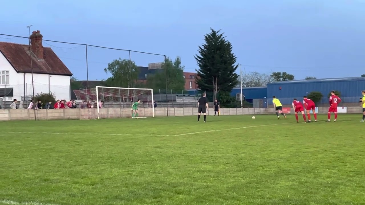 Camberley Town keeper Billy Ludlow saves penalty from Knaphill Combined Counties League May 2023
